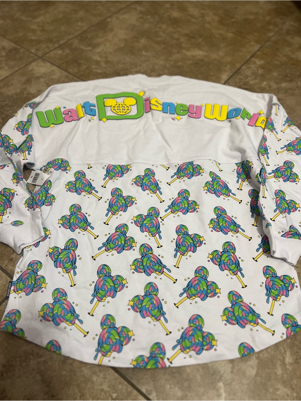 Disney White Long Sleeve women’s Top with Multicolor Lollipop Pattern